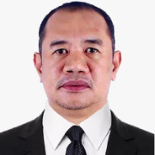 Mr. Antonio M. Magnaye, Jr., Provincial Public Employment Services Officer, in a suit and tie
