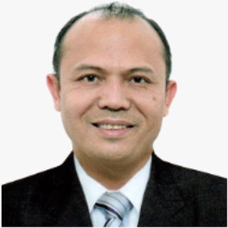 Dr. Dante A. Nuestro, MHA, Chief of Hospital, OMCDH, in a suit and tie