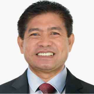 Mr. Junielo P. Alcuran, Supervising Administrative Officer, SCD, in a suit and tie