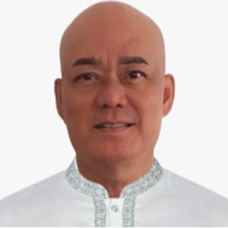 Mr. Rafael C. Cataquis, RN, Administrative Officer IV, GSMAC, wearing a white barong