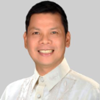 Hon. Rolando H. Ruga, Board Member, in a barong