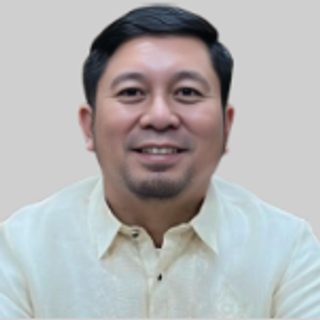 Hon. Ryan Z. Arago, Board Member, in a barong