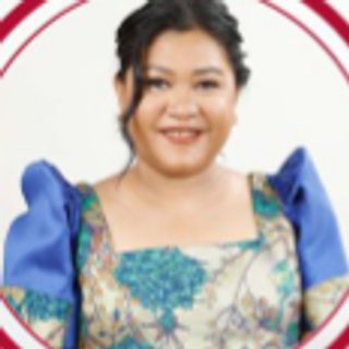 Hon. Jannet T. Maboloc, City Councilor, in a blue patterned blouse