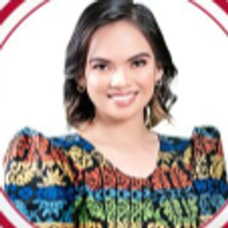 Hon. Julienne Angel Capuyan, SK Federation President and Ex-Officio City Councilor, in a colorful patterned blouse